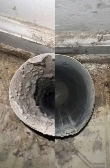Inside of a dryer duct caked with lint, then cleaned